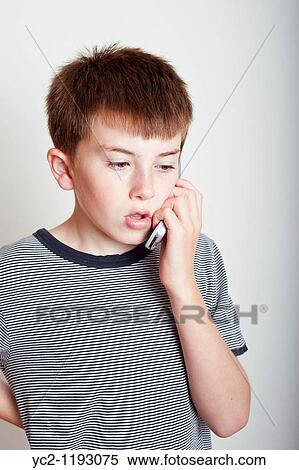 10 year old boy talking on the phone in the studio View Large Photo Image Stock Photography - 10 year old boy talking on the phone in the studio. Fotosearch
