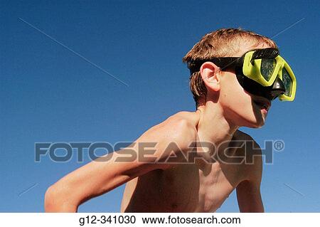 10 year old boy wearing goggles in swimming pool View Large Photo Image Stock Image - 10 year old boy wearing goggles in swimming pool. Fotosearch