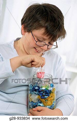 10 year old boy with candies, obesity View Large Photo Image Picture - 10 year old boy with candies, obesity. Fotosearch