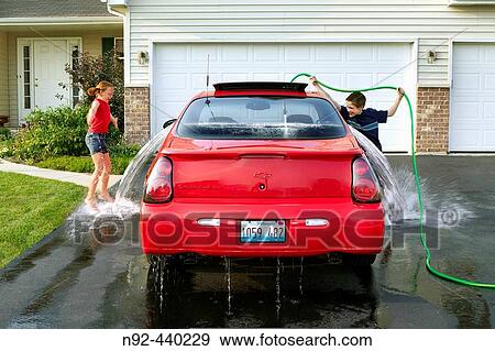 10 year old girl and 8 year old boy. Shot in middle class suburbs of Chicago at 6: 30 PM. USA. View Large Photo Image Stock Photo - 10 year old girl and 8 year old boy. Shot in middle class suburbs of Chicago at 6: 30 PM. USA.. Fotosearch