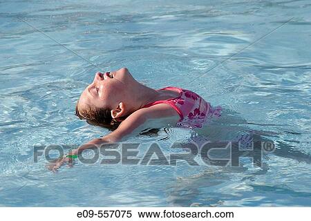 10-year-old girl in swimming pool, face up to sun, back curved, between standing and floating, wearing pink-and-white swimsuit -- Bloomington, Indiana, U. S. A. -- horizontal View Large Photo Image Stock Photography - 10-year-old girl in swimming pool, face up to sun, back curved, between standing and floating, wearing pink-and-white swimsuit -- Bloomington, Indiana, U. S. A. -- horizontal. Fotosearch