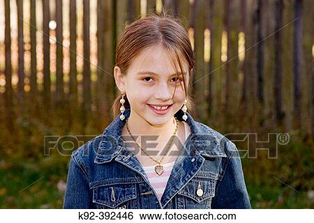 10 year old girl standing in her backyard in Annapolis, Maryland. View Large Photo Image Stock Photograph - 10 year old girl standing in her backyard in Annapolis, Maryland.. Fotosearch