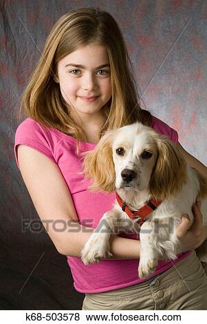 10 year old girl with puppy (Cocker Spaniel-poodle cross) View Large Photo Image Stock Photo - 10 year old girl with puppy (Cocker Spaniel-poodle cross). Fotosearch