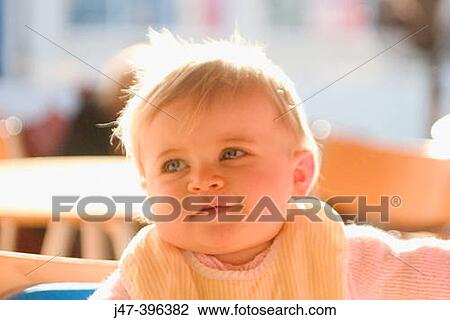 11 month old baby sitting with bib on smiling View Large Photo Image Stock Image - 11 month old baby sitting with bib on smiling. Fotosearch