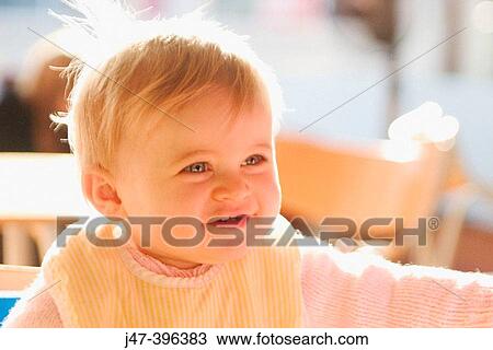 11 month old baby sitting with bib on smiling View Large Photo Image Stock Image - 11 month old baby sitting with bib on smiling. Fotosearch