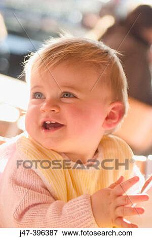 11 month old baby sitting with bib on smiling, clapping her hands View Large Photo Image Stock Photo - 11 month old baby sitting with bib on smiling, clapping her hands. Fotosearch