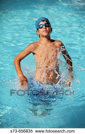 11 year old boy in swimming pool View Large Photo Image Stock Photography - 11 year old boy in swimming pool. Fotosearch