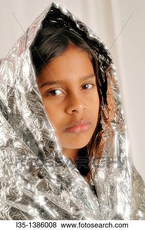 11 year old Indian girl wrapped in silver foil looks like a Maddonna View Large Photo Image Stock Photo - 11 year old Indian girl wrapped in silver foil looks like a Maddonna. Fotosearch