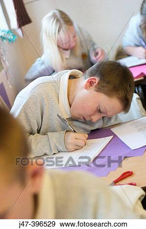 12 year old boy, sitting in class, drawing View Large Photo Image Stock Photo - 12 year old boy, sitting in class, drawing. Fotosearch