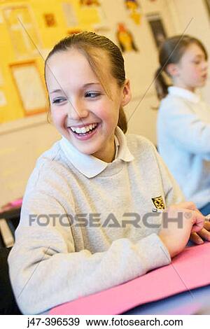 12 year old girl, sitting in class, drawing, smiling off camera View Large Photo Image Stock Photo - 12 year old girl, sitting in class, drawing, smiling off camera. Fotosearch