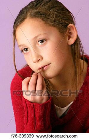 12 year old girl suffering from disease of trichotillomania, in which one pulls out ones own hair, often eating or chewing it View Large Photo Image Stock Photo - 12 year old girl suffering from disease of trichotillomania, in which one pulls out ones own hair, often eating or chewing it. Fotosearch