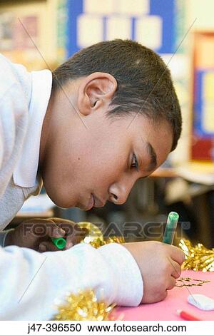 12 year old pakistani boy, sitting in class, concentrating, drawing View Large Photo Image Stock Image - 12 year old pakistani boy, sitting in class, concentrating, drawing. Fotosearch
