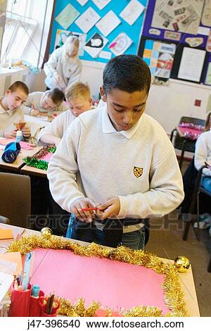 12 year old pakistani boy standing up in a class of children View Large Photo Image Stock Image - 12 year old pakistani boy standing up in a class of children. Fotosearch