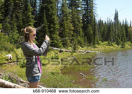 13 year old girl taking picture by Summit Lake, Waterton Lakes National Park, Alberta, Canada View Large Photo Image Stock Photo - 13 year old girl taking picture by Summit Lake, Waterton Lakes National Park, Alberta, Canada. Fotosearch