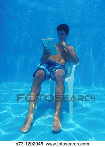 13 years old boy reading underwater View Large Photo Image Stock Photography - 13 years old boy reading underwater. Fotosearch