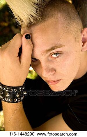 14 Year Old Teenage Boy With Bleached Hair And A Spiked Mohawk