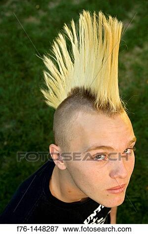 14 year old teenage boy with bleached hair and a spiked mohawk haircut, MR  071007-1 Stock Photo | f76-1448287 | Fotosearch