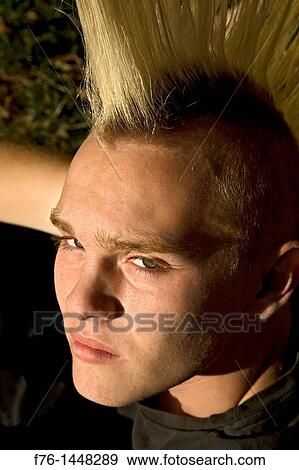 14 year old teenage boy with bleached hair and a spiked mohawk haircut, MR 071007-1 View Large Photo Image Stock Photo - 14 year old teenage boy with bleached hair and a spiked mohawk haircut, MR 071007-1. Fotosearch
