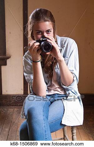 15 year old girl sits in an old abandoned house with her camera View Large Photo Image Stock Photo - 15 year old girl sits in an old abandoned house with her camera. Fotosearch