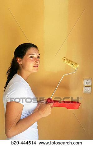 16 year old teengirl painting wall, home improvement View Large Photo Image Picture - 16 year old teengirl painting wall, home improvement. Fotosearch
