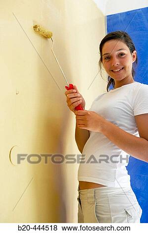 16 year old teengirl painting wall, home improvement View Large Photo Image Stock Photo - 16 year old teengirl painting wall, home improvement. Fotosearch