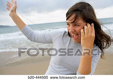 16 year old teengirl using cell phone at beach View Large Photo Image Stock Image - 16 year old teengirl using cell phone at beach. Fotosearch