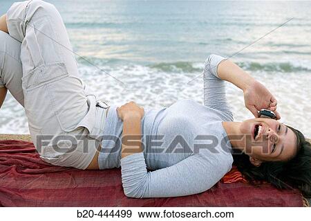 16 year old teengirl using cell phone on beach View Large Photo Image Stock Photo - 16 year old teengirl using cell phone on beach. Fotosearch