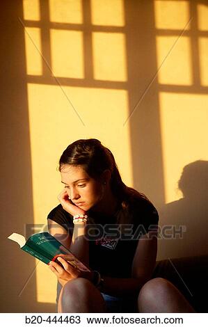 16 years old teenager reading a book. View Large Photo Image Stock Image - 16 years old teenager reading a book.. Fotosearch
