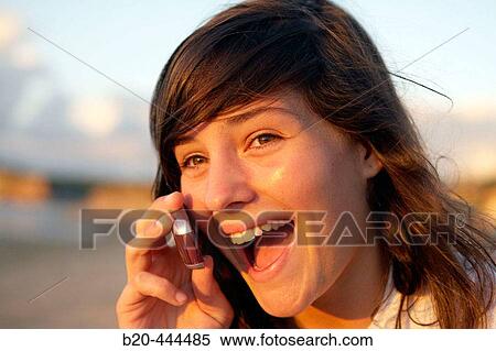 16 years old teenager talking on a mobile phone. Hendaye beach. Aquitaine. France. View Large Photo Image Stock Photography - 16 years old teenager talking on a mobile phone. Hendaye beach. Aquitaine. France.. Fotosearch