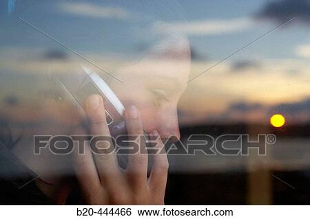 16 years old teenager with mobile phone in the evening. View Large Photo Image Stock Photograph - 16 years old teenager with mobile phone in the evening.. Fotosearch