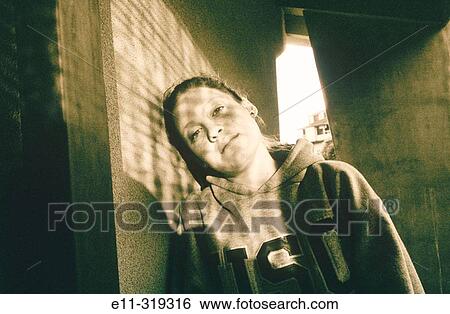 Stock Photograph - 17 years old girl with dappled light. Fotosearch
