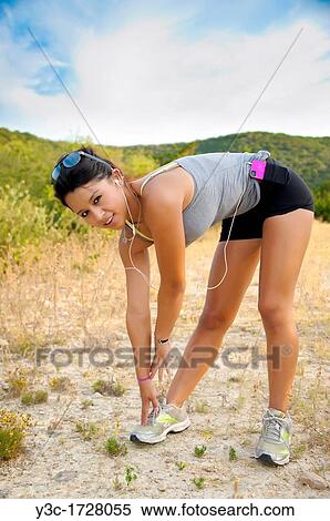 17 years old hispanic girl in fitness outfit stretching and getting ready to work out outdoors View Large Photo Image Stock Photography - 17 years old hispanic girl in fitness outfit stretching and getting ready to work out outdoors. Fotosearch
