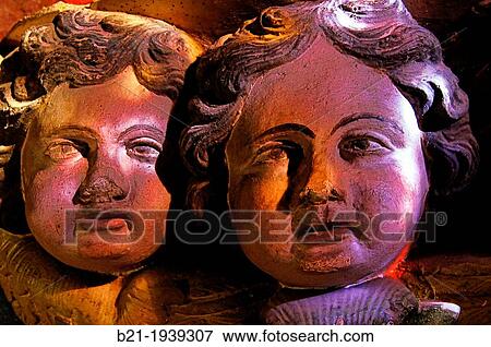 17th century wooden cherubs at Saint Pierre church, Collonges-la-Rouge, Corr? ze, Limousin, France View Large Photo Image Stock Photo - 17th century wooden cherubs at Saint Pierre church, Collonges-la-Rouge, Corr? ze, Limousin, France. Fotosearch