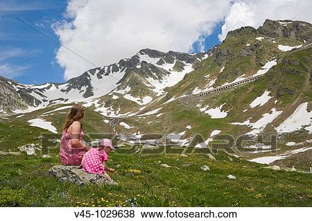 18 and 3 years old girls enjoying the view of Pennine Alps. Valais Alps from Great St Bernard Pass. Western Alps. Italy. View Large Photo Image Stock Photo - 18 and 3 years old girls enjoying the view of Pennine Alps. Valais Alps from Great St Bernard Pass. Western Alps. Italy.. Fotosearch