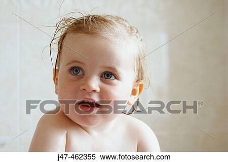 18 month old baby girl, sitting in the bath, smiling off camera View Large Photo Image Stock Photography - 18 month old baby girl, sitting in the bath, smiling off camera. Fotosearch