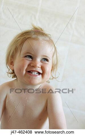 18 month old baby girl, standing up in the bath grinning off camera View Large Photo Image Stock Photo - 18 month old baby girl, standing up in the bath grinning off camera. Fotosearch