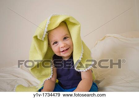 18 month old boy on a bed View Large Photo Image Stock Photo - 18 month old boy on a bed. Fotosearch
