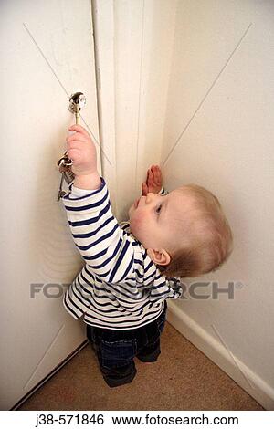 18 month old boy playing with keys, UK View Large Photo Image Stock Photograph - 18 month old boy playing with keys, UK. Fotosearch