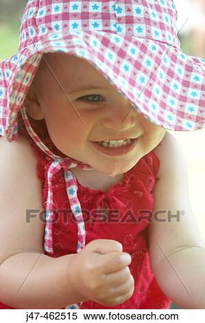 18 month old girl outside in big floppy hat, clasping her hands together in excitement. View Large Photo Image Stock Photography - 18 month old girl outside in big floppy hat, clasping her hands together in excitement.. Fotosearch