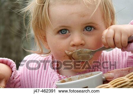 18 month old girl sitting eating coffee froth with it all round her mouth View Large Photo Image Stock Image - 18 month old girl sitting eating coffee froth with it all round her mouth. Fotosearch