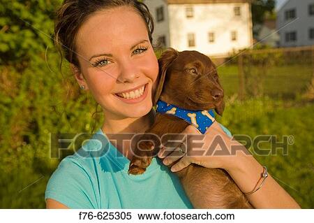 18 year old girl with her 2 month old miniature dachshund puppy View Large Photo Image Stock Photography - 18 year old girl with her 2 month old miniature dachshund puppy. Fotosearch
