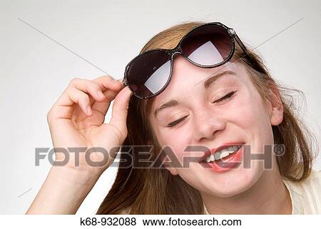 18 year old girl with sunglasses in studio portrait View Large Photo Image Stock Photo - 18 year old girl with sunglasses in studio portrait. Fotosearch