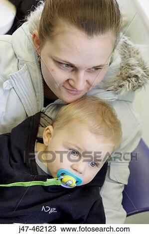 18 year old young mother with her 1 year old baby sucking a dummy View Large Photo Image Stock Image - 18 year old young mother with her 1 year old baby sucking a dummy. Fotosearch