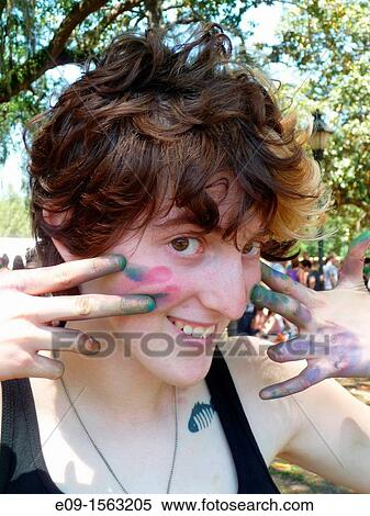 19-year-old art student with sidewalk chalk on face and hands, holding fingers to cheek and smiling, wearing tank top, tattoo on one shoulder, at sidewalk art festival in Savannah, GA View Large Photo Image Stock Photography - 19-year-old art student with sidewalk chalk on face and hands, holding fingers to cheek and smiling, wearing tank top, tattoo on one shoulder, at sidewalk art festival in Savannah, GA. Fotosearch