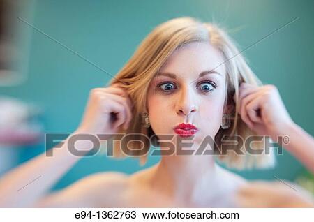 19 year old blond woman making a funny face View Large Photo Image Stock Image - 19 year old blond woman making a funny face. Fotosearch