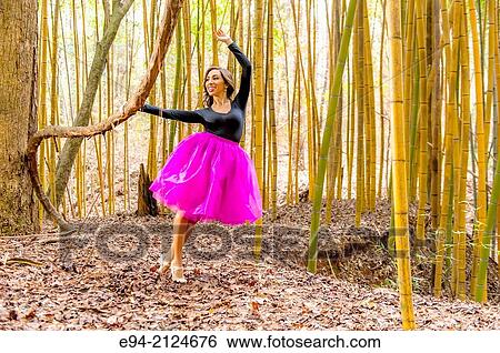 19 year old brunette woman in dance clothing on a path in a bamboo forest. View Large Photo Image Stock Photograph - 19 year old brunette woman in dance clothing on a path in a bamboo forest.. Fotosearch