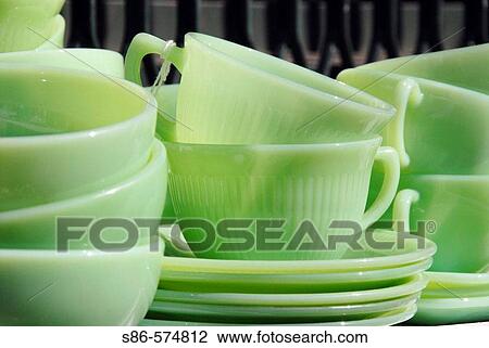 1950's Vintage Green Glass Dishes displayed at an outdoor flea market View Large Photo Image Stock Image - 1950's Vintage Green Glass Dishes displayed at an outdoor flea market. Fotosearch