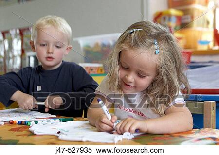 2, 3 year olds sitting drawing at nursery View Large Photo Image Stock Photography - 2, 3 year olds sitting drawing at nursery. Fotosearch