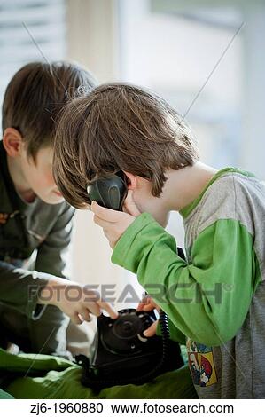 2 boy playing with a retro telephone. View Large Photo Image Stock Image - 2 boy playing with a retro telephone.. Fotosearch