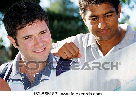2 men looking at map together View Large Photo Image Stock Image - 2 men looking at map together. Fotosearch